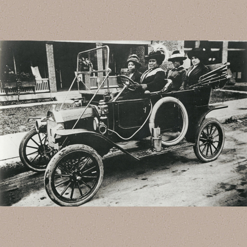 Madam C.J. Walker (driving) with (left to right) her niece Anjetta Breedlove, Madam C.J. Walker Manufacturing Company factory forelady (manager) Alice Kelly, and Walker Company bookkeeper Lucy Flint. | New York Public Library | Date Created/Published: 1911