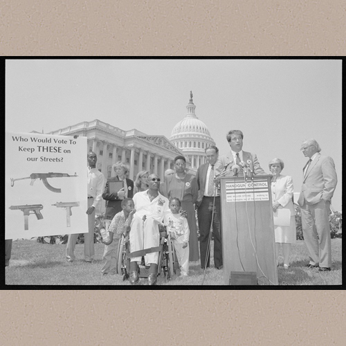 Press conference on the crime bill outside of the U.S. Capitol showing President of Handgun Control, Inc., Richard Aborn; victim of gun violence Ronald Shepperson and family, and Representatives Christopher Shays and Margaret Roukema] | Library of Congress Prints and Photographs Division Washington, D.C. 20540 USA | Beall, Kathleen R., photographer | Date Created/Published: [9 August 1994]