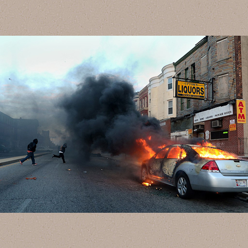 Young black men run across the street as a car burns after being set on fire during a riot which broke out after the funeral of Freddie Gray in Baltimore, Md. April 27, 2015. Gray, died April 19 from a severe spinal injury that allegedly occurred while in police custody. Looting and riots broke out in Baltimore after the funeral. The Maryland governor declared a state of emergency. | wikimedi.org | U.S. Air Force photo by Staff Sgt. Kenny Holston | Date Created/Published: 27 April 2015